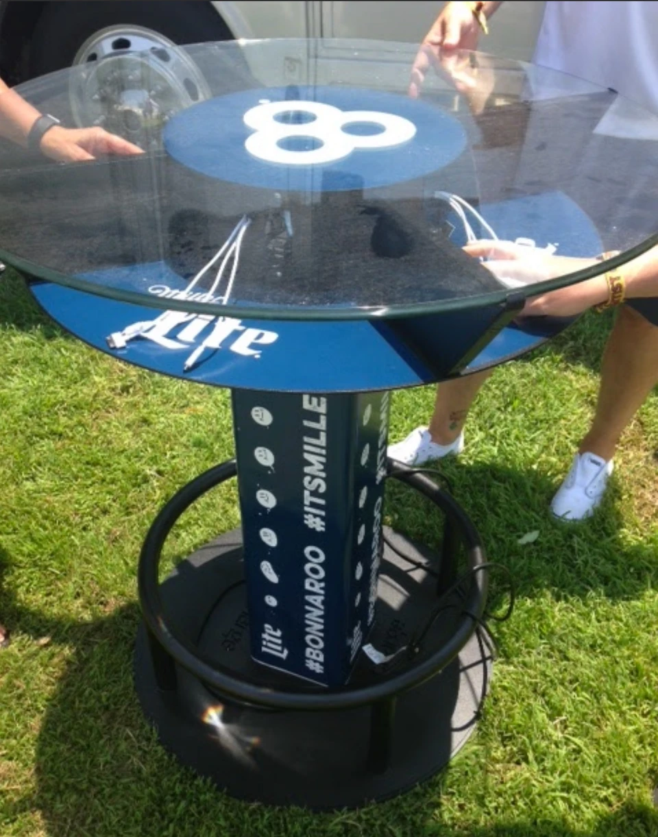 An outdoor Miller Lite charging station with can-inspired graphics.
