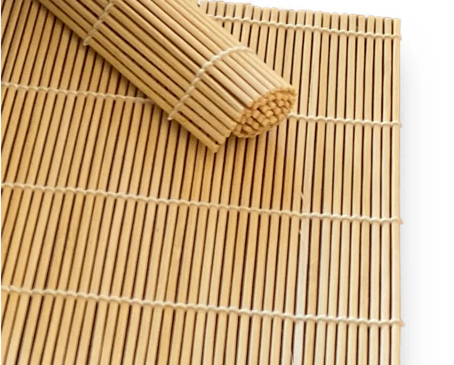 A natural bamboo rolling mat, the makisu, partly rolled